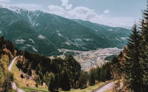 Preview wallpaper mountains, road, landscape, sun, trees, slope