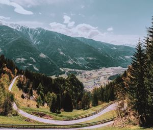 Preview wallpaper mountains, road, landscape, sun, trees, slope