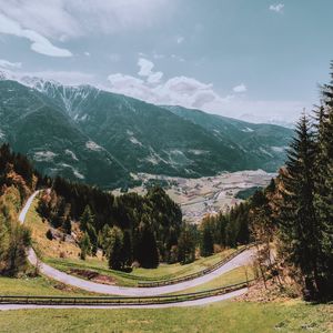 Preview wallpaper mountains, road, landscape, sun, trees, slope