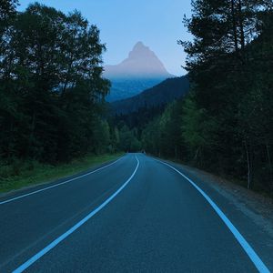 Preview wallpaper mountains, road, marking, trees, branches