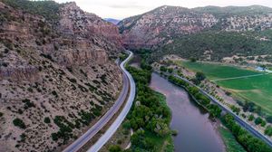 Preview wallpaper mountains, road, river, top view