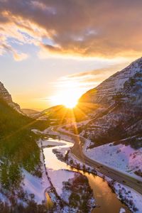 Preview wallpaper mountains, road, river, sun, landscape