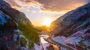 Preview wallpaper mountains, road, river, sun, landscape