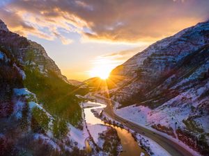 Preview wallpaper mountains, road, river, sun, landscape