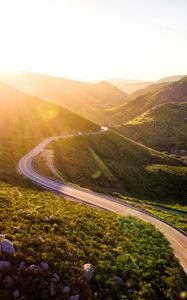 Preview wallpaper mountains, road, serpentine, sunset