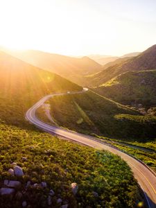 Preview wallpaper mountains, road, serpentine, sunset