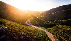 Preview wallpaper mountains, road, serpentine, sunset