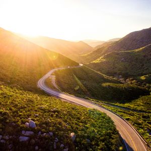 Preview wallpaper mountains, road, serpentine, sunset