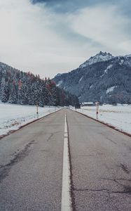 Preview wallpaper mountains, road, snow, marking, trees