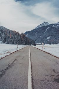 Preview wallpaper mountains, road, snow, marking, trees