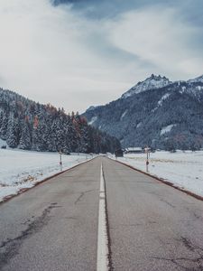 Preview wallpaper mountains, road, snow, marking, trees