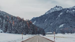 Preview wallpaper mountains, road, snow, marking, trees