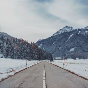 Preview wallpaper mountains, road, snow, marking, trees