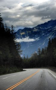 Preview wallpaper mountains, road, spruce, trees, marking