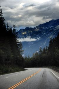 Preview wallpaper mountains, road, spruce, trees, marking