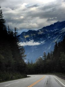 Preview wallpaper mountains, road, spruce, trees, marking