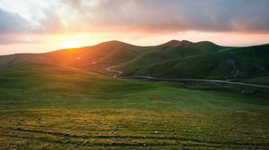 Preview wallpaper mountains, road, sunset, field