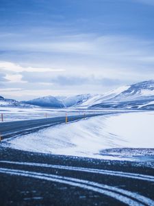 Preview wallpaper mountains, road, turn, snow, winter, snowy