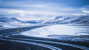 Preview wallpaper mountains, road, turn, snow, winter, snowy