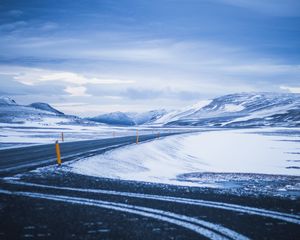 Preview wallpaper mountains, road, turn, snow, winter, snowy