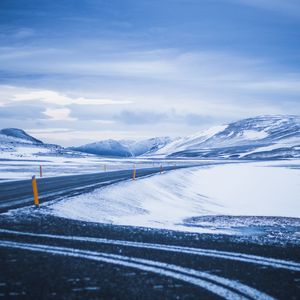 Preview wallpaper mountains, road, turn, snow, winter, snowy