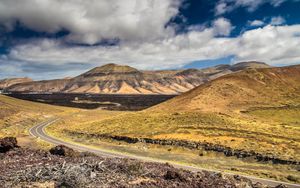 Preview wallpaper mountains, road, winding, sky