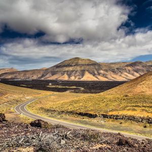 Preview wallpaper mountains, road, winding, sky