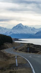 Preview wallpaper mountains, road, winding, lake