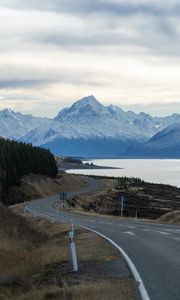 Preview wallpaper mountains, road, winding, lake