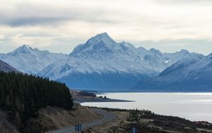 Preview wallpaper mountains, road, winding, lake