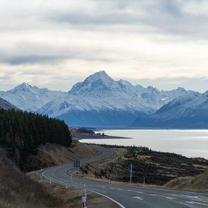 Preview wallpaper mountains, road, winding, lake