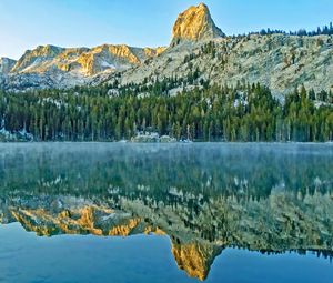 Preview wallpaper mountains, rock, forest, reflection, lake, nature