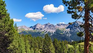 Preview wallpaper mountains, rocks, branches, trees, sky, clouds