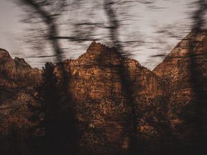 Preview wallpaper mountains, rocks, brown, trees, blur