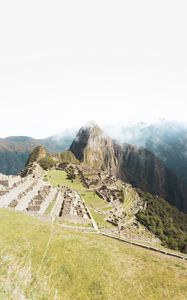 Preview wallpaper mountains, rocks, buildings, ancient, architecture