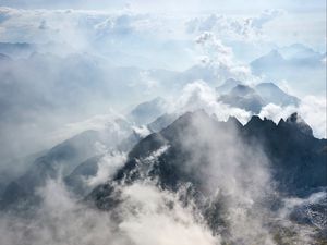 Preview wallpaper mountains, rocks, clouds, fog, grass