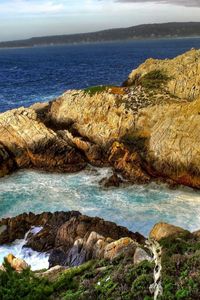 Preview wallpaper mountains, rocks, coast, stones, sea, vegetation, horizon, landscape