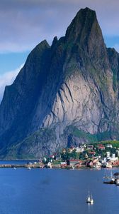 Preview wallpaper mountains, rocks, coast, sky, clouds, city, port, house