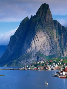 Preview wallpaper mountains, rocks, coast, sky, clouds, city, port, house