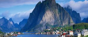 Preview wallpaper mountains, rocks, coast, sky, clouds, city, port, house