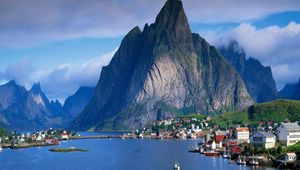 Preview wallpaper mountains, rocks, coast, sky, clouds, city, port, house