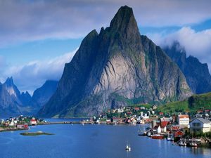 Preview wallpaper mountains, rocks, coast, sky, clouds, city, port, house