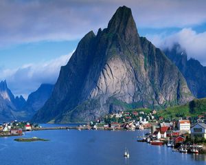 Preview wallpaper mountains, rocks, coast, sky, clouds, city, port, house