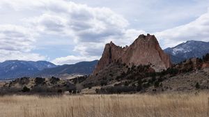 Preview wallpaper mountains, rocks, field, clouds, nature