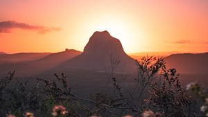 Preview wallpaper mountains, rocks, flowers, sunset, peak