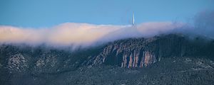 Preview wallpaper mountains, rocks, fog, tower, nature