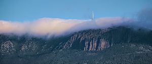 Preview wallpaper mountains, rocks, fog, tower, nature