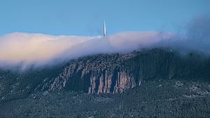 Preview wallpaper mountains, rocks, fog, tower, nature