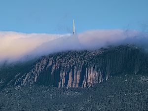 Preview wallpaper mountains, rocks, fog, tower, nature