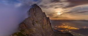 Preview wallpaper mountains, rocks, fog, slope, clouds